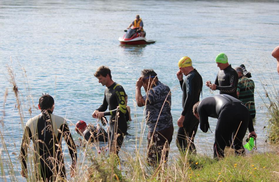 Swimmers line up to take part in the Ken Milne Classic triathlon at the Clutha River in Balclutha...