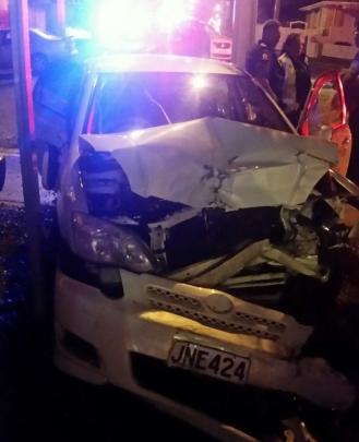 This hatchback was damaged when it hit the parked ute.