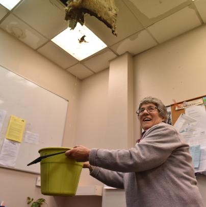 Dr Maureen Houstoun, of the Dunedin Urgent Doctors and Accident Centre, holds a bucket under a...