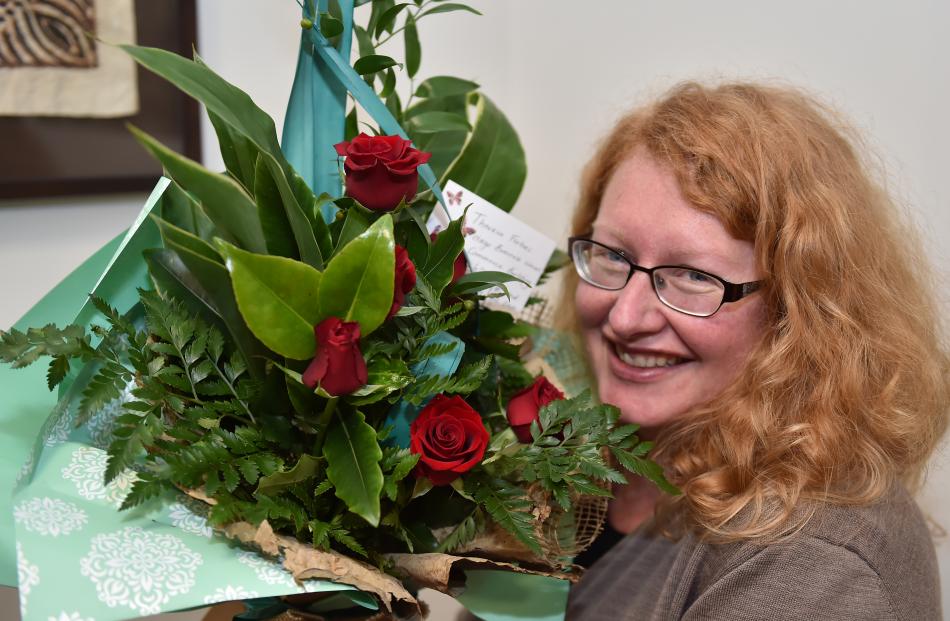 Theresa Forbes was given a bouquet of red roses at the University of Otago campus in Dunedin...