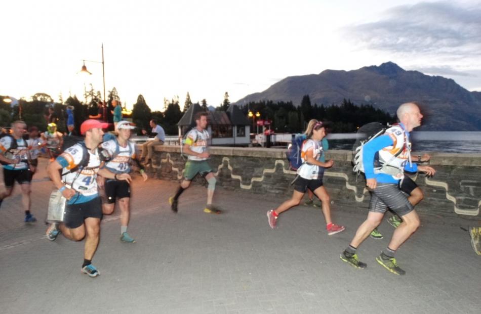 Godzone competitors pound the pavement, usually clogged with tourists, along Queenstown Bay this...