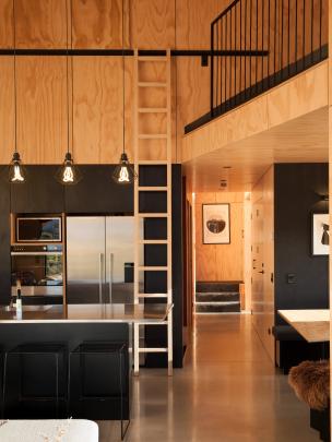 The ladder in the kitchen leads to the mezzanine which can be used as a sitting or sleeping area....