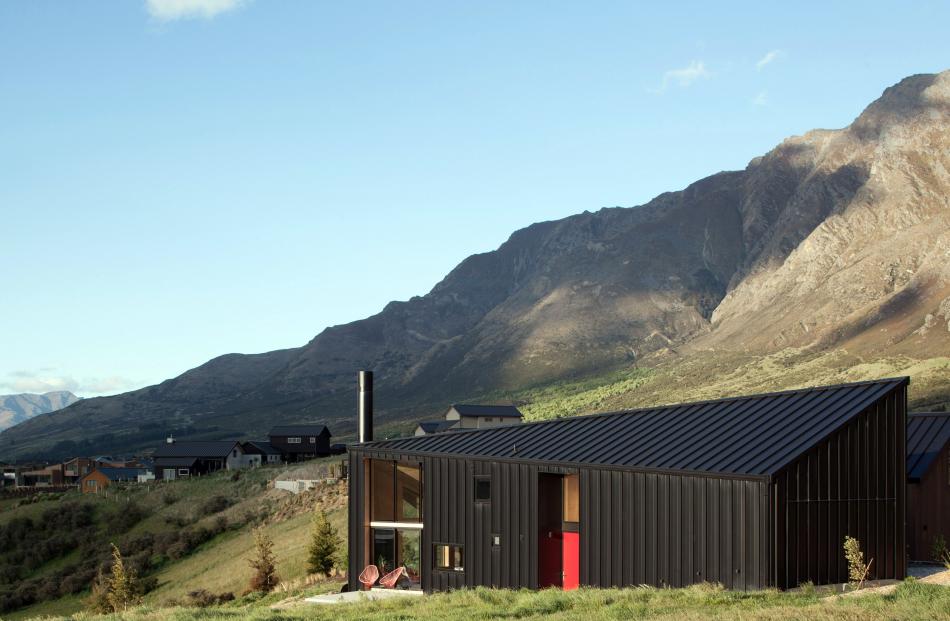 This asymmetrical-shaped home nestled under the mountains near Queenstown packs a lot into its...