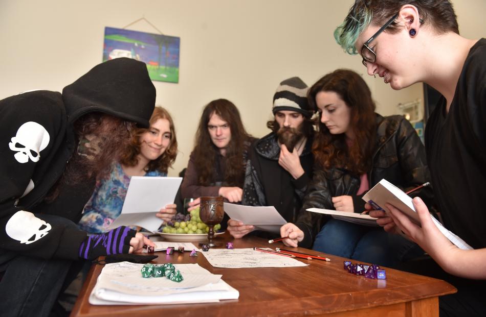 Dungeons & Dragons players (from left) Morgan Stanley (19), Jasmine Mawson (21), Daniel Stride (34), Steven Hindle (26), Jess Keogh (24) and Rowan Stanley (24) satisfy their thirst for fantasy. Photos by Peter Mcintosh.