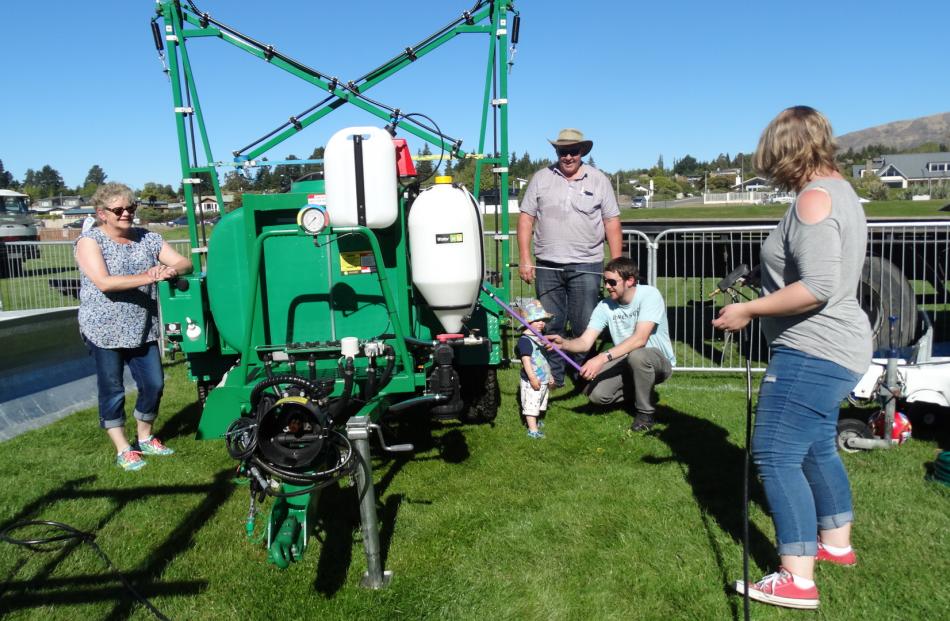 Dianne (left) and David Ensor (second from left), of Gore, and their son Kade Ensor and his wife Hayley, of Dunedin, introduce the younger Ensors' son Arthur (20 months) to the family farm machinery business. 