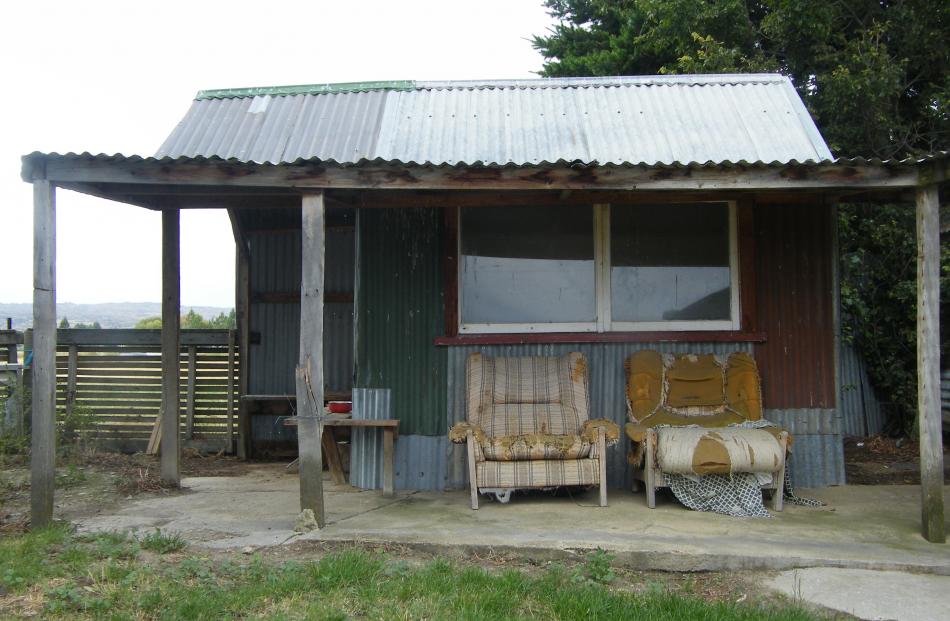 Porches, outbuildings and old couches add character to the old Moa Creek Hotel and shop. The...