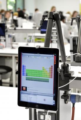 Each new lab station includes an iPad, on which the students will be able to complete tests and...