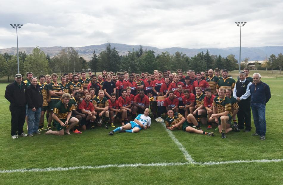 Cromwell and Eastern Rugby Club members surround their mate Andrew Grubb's ashes after the inaugural Andrew Grubb Memorial Game in Cromwell on Saturday. Photos by Pam Jones.