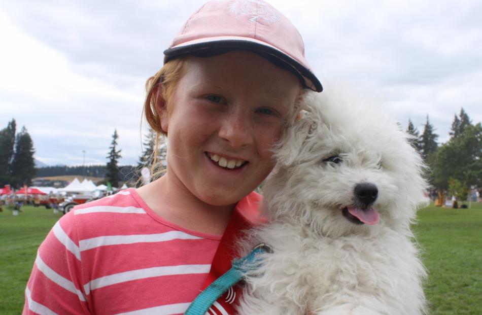 Winner of the Best Pet award at the Wanaka A&P Show, Max gets a well-deserved rest with his owner, Charlotte Davie (9), of Clydevale.