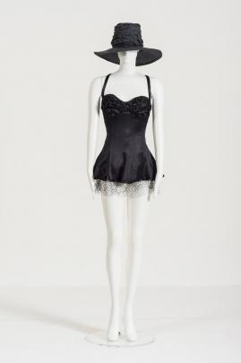 Margo Barton’s Black Swimsuit and Hat 1992 nylon lycra and nylon net; straw hat, part of a collection, courtesy of  Margo Barton. PHOTO: MARGO BARTON 