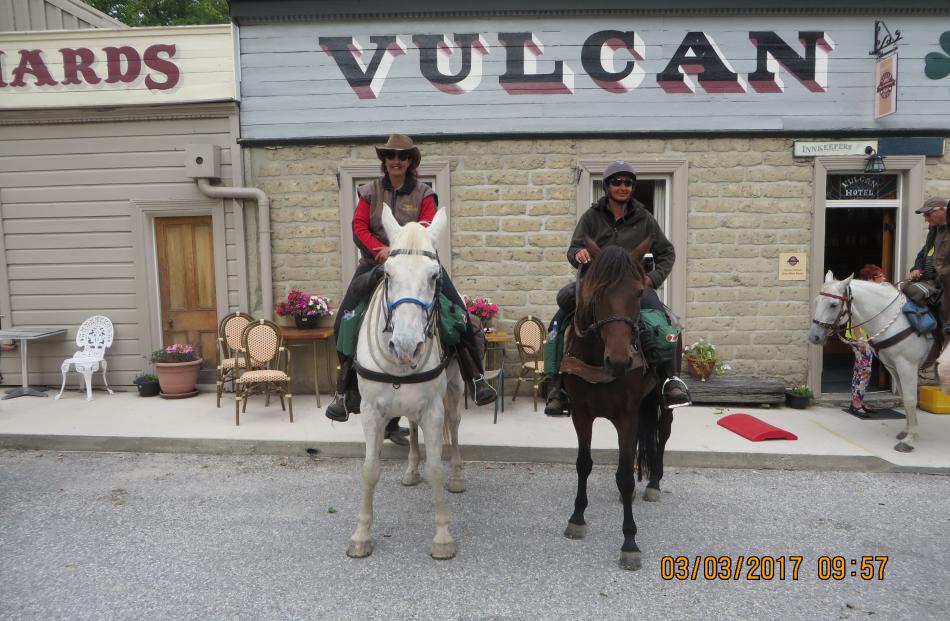 Cavalcade participants Toni Arden (left), on Puddles, and Megan Kelly, on Tui, both of Timaru, at the Vulcan Hotel, in St Bathans, on the way to Omakau. Photos supplied.