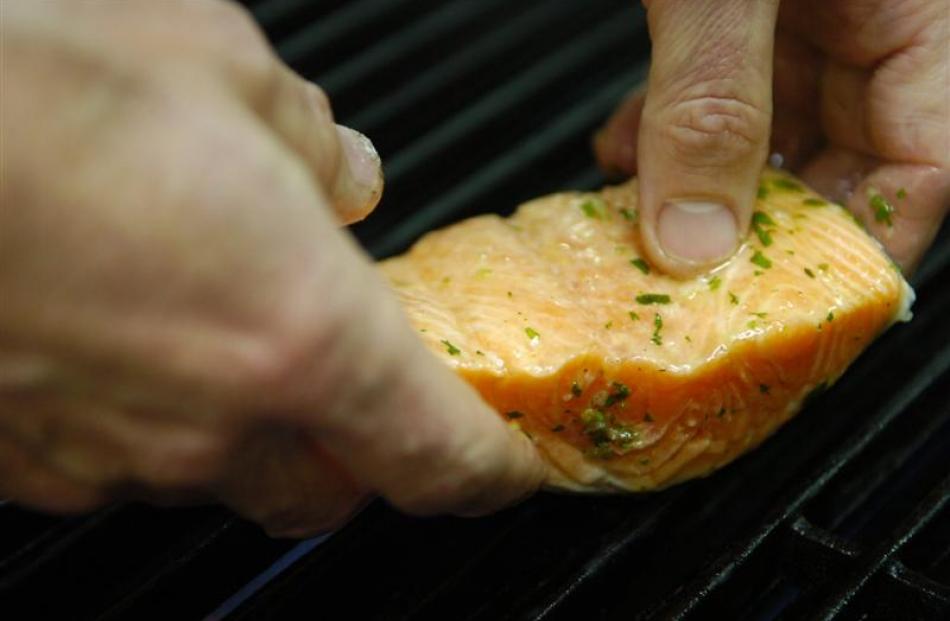 Place salmon on the grill, skin side down, which will be the presentation side.