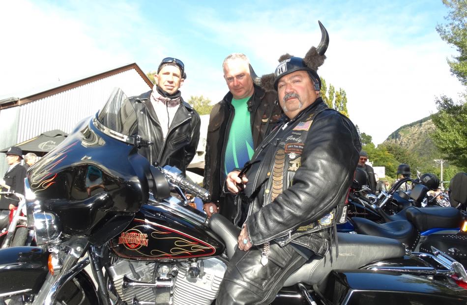 Bronx Gordo, of the US, on his Harley-Davidson 2000 Electroglide, with Shawn Stapleton (left), of...