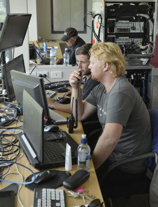 Part of the Virtual Eye technology team in the media centre at the University Oval yesterday are...