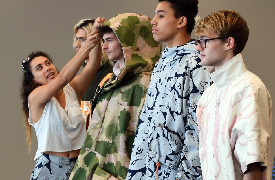 Talia Jimenez explains her collection to the judges.
