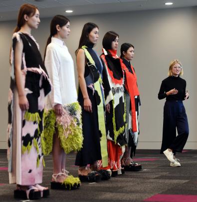 Natalie Vladimiroff explains her designs to the judges. 