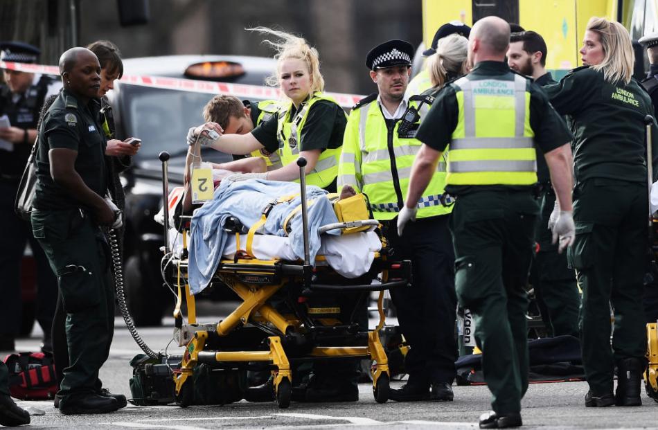 Emergency services tend to an injured person. Photo: Getty Images 