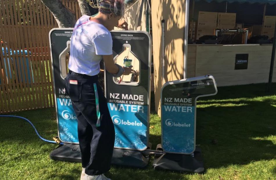 A festival-goer refills at one of the many water fountains. Photos: Gina Dempster.
