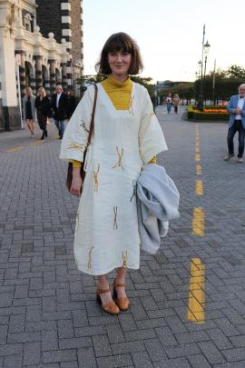 Annabelle wears a turtle-neck she borrowed from her flatmate, a dress she made herself and shoes...