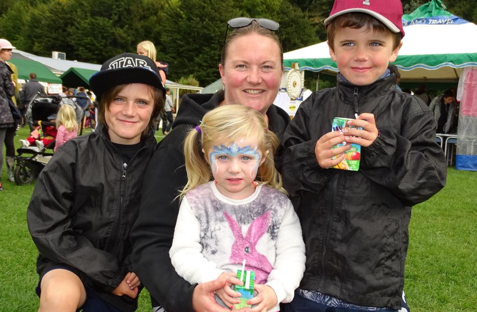 The Brazier family take a break at the Queenstown Primary School fair (from left) Hayden (8), Kensi (2), Donna and Tristan (5).