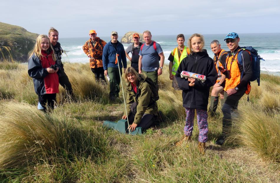 New Zealand Deerstalkers' Association Otago branch members check traps on Otago Peninsula on Saturday.