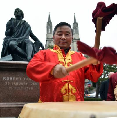 Dragon Dancing Team member Hu Zhang, of Dunedin, beats a Chinese drum  in the Octagon last night...