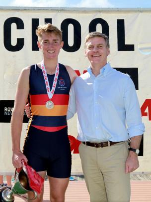 John McGlashan College's Bradley Leydon alongside Bill English yesterday after his win in the...