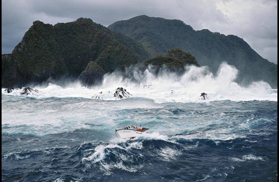 One of Andris Apse's startling images, a fishing boat in a storm off Breaksea Island, Fiordland. Photo by Andris Apse.