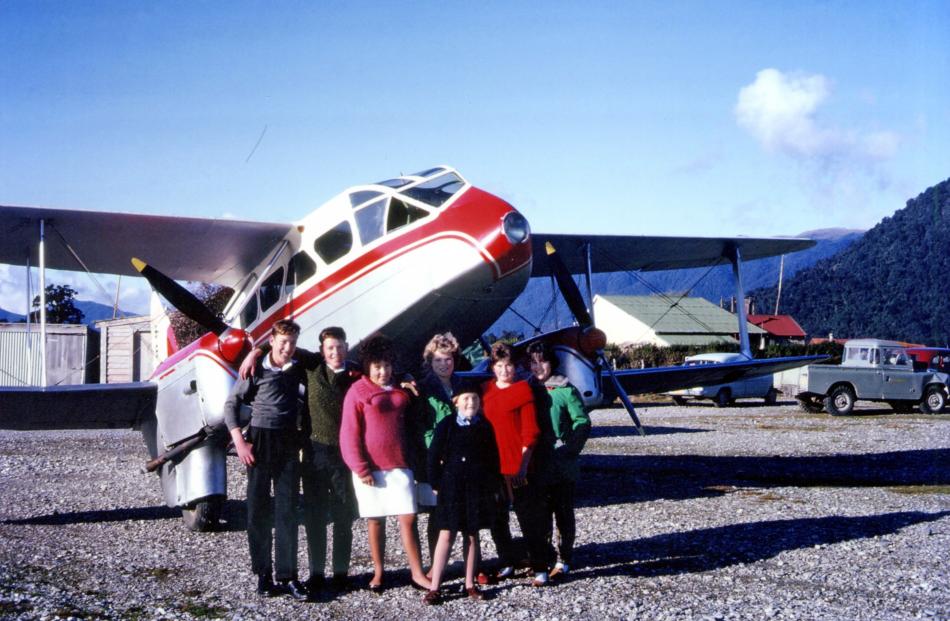 At the end of the May school holidays in 1962, youngsters gather at Haast airfield to say goodbye...