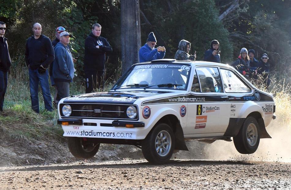 Tony Gosling and Blair Read fly out of a dry ford at Whare Flat in their Ford Escort during the classic car section of Rally Otago. Photo by Stephen Jaquiery.