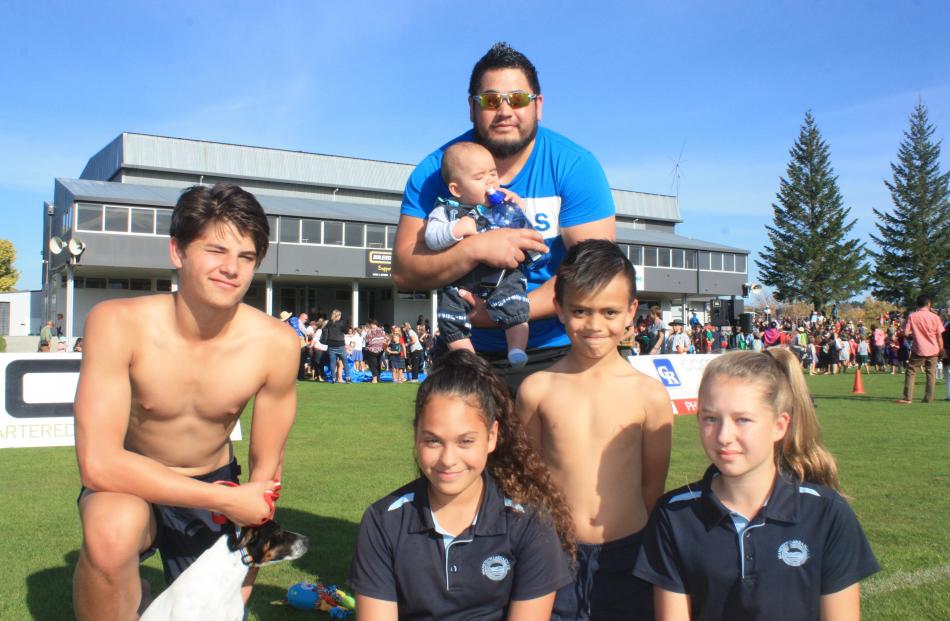 (From left) Jo Fahm (14), Harmony Devitt(12), Jay, Kahu (6 months) and Latrell Striger (7) and...