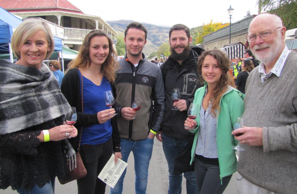 Rory Butler (right) enjoys the Clyde Wine and Food Harvest Festival with (from left) Glenys Coughlan and Lucie Cornu, Julien Mongeot, Emmanuel Rostaing-Tayard and Carine Aynard yesterday. Photos by Pam Jones.