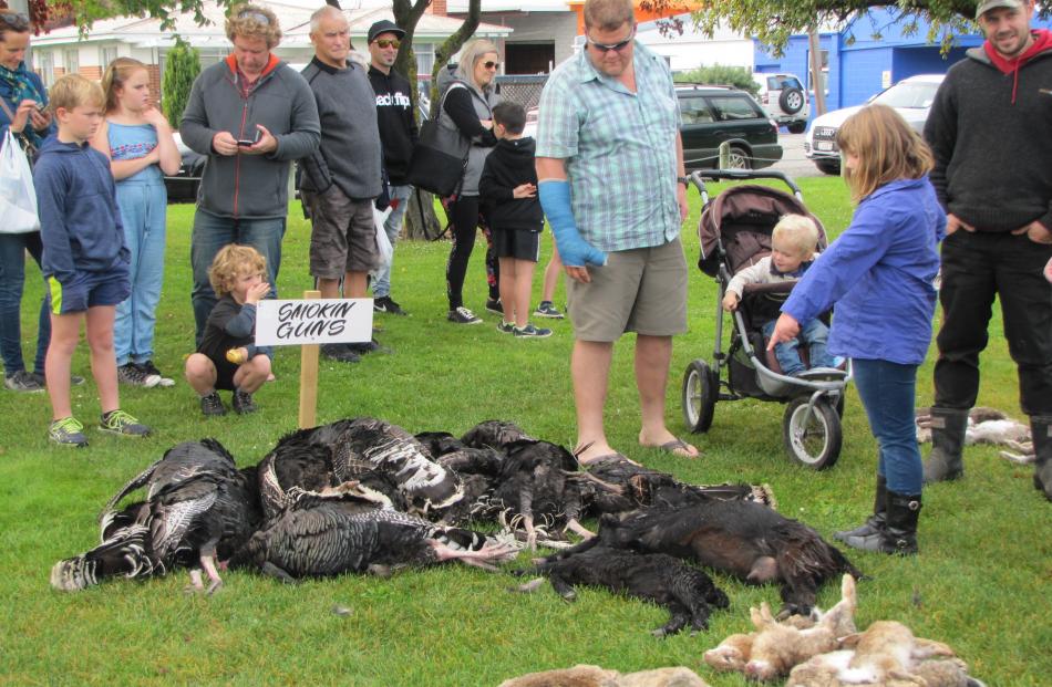 Members of the East West Bunny Boppers, of Greymouth, line up their rabbits at the end of the...