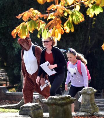 Steve, Tracey and Lily (8) Havard leave the Southern Cemetery. Photos: Peter McIntosh.