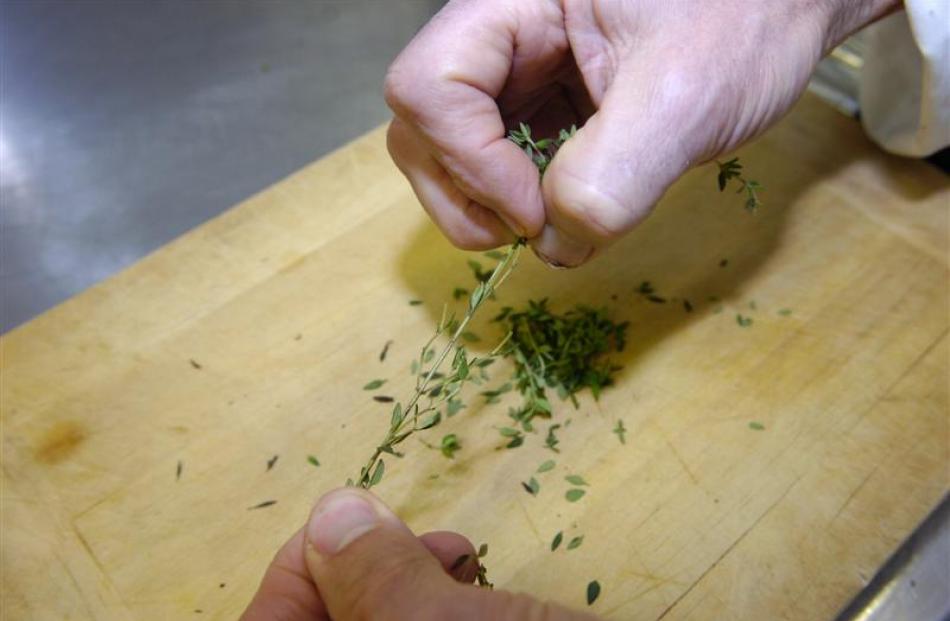 Remove leaves from the herb sprigs and discard tough stems.