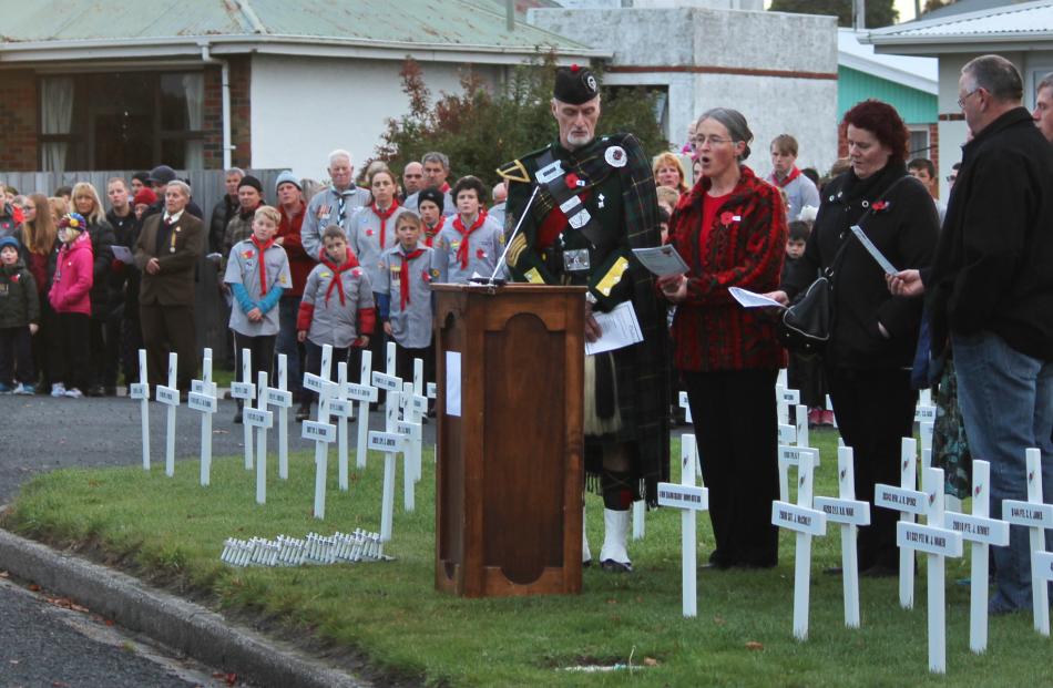 The wreath-laying ceremony at the Balclutha dawn service. Photo by Samuel White.