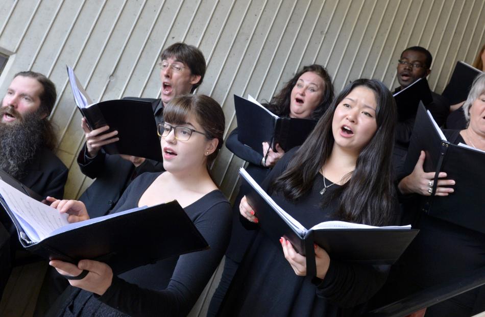 the Southern Consort of Voices sing from the stairwell at the Dunedin City Library's Nook and Cranny Music Festival. Photo: Gerard O'Brien.