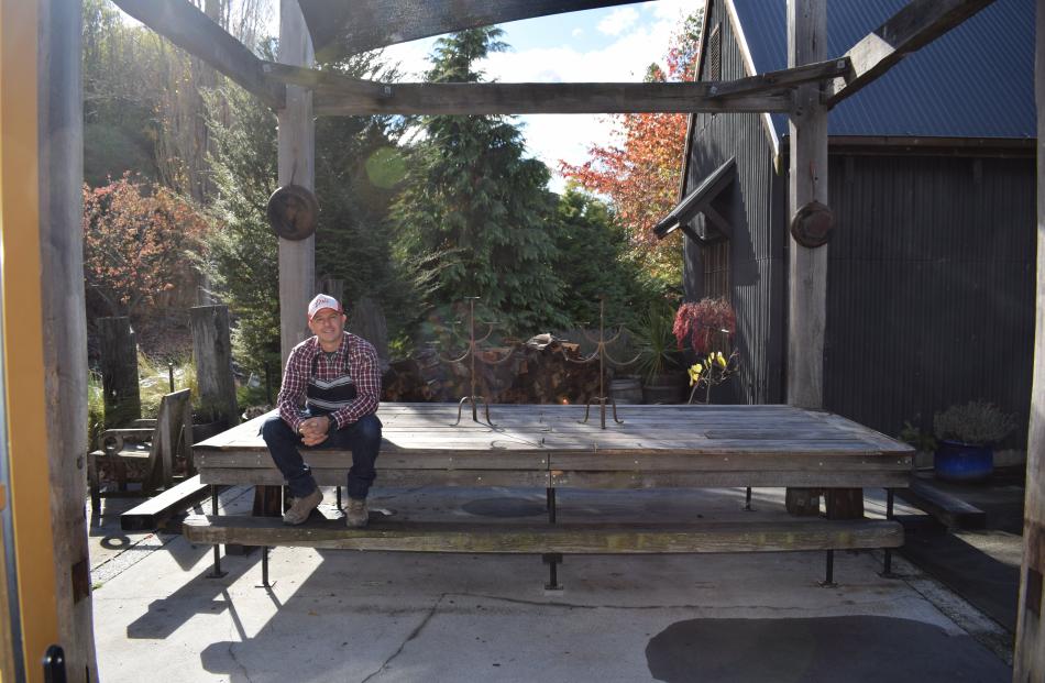 Celebrity chef Angelo Georgalli enjoying the sun in the outdoor eating area of his recently...
