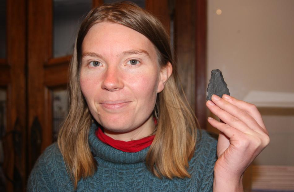 North Otago Museum curator Chloe Searle with one of the collection’s flakes. Photo: Shannon Gillies.