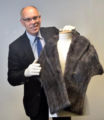 Murray Lawrence admires a sapphire marmot stole from the estate of his late aunt, Dunedin’s first female ‘‘acting detective’’ Lenore Wilson (nee Lawrence). Photo: Peter McIntosh