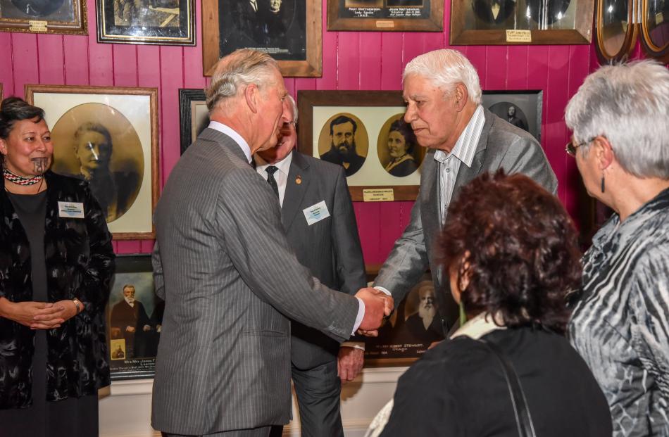 Prince Charles is greeted by Paul Karaitiana, of Otakou, a descendant of settler Octavius Harwood...
