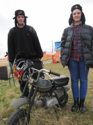 Callum Dodds and Amy Lamb, both of Dunedin, look over Mr Dodds' Honda Z50 at the Brass Monkey...