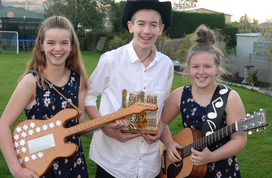 The group Mac is (from left) siblings Alyssa (12) and Campbell (14) Landrebe and Michelle...