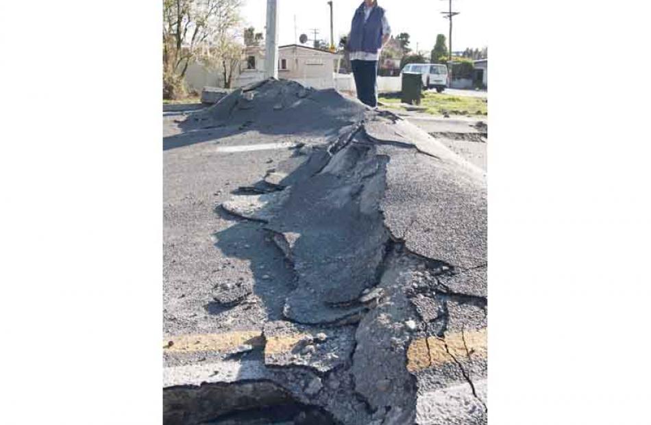 Damaged road at Pines Beach near Kaiapoi after the earthquake, Christchurch, New Zealand, Monday...