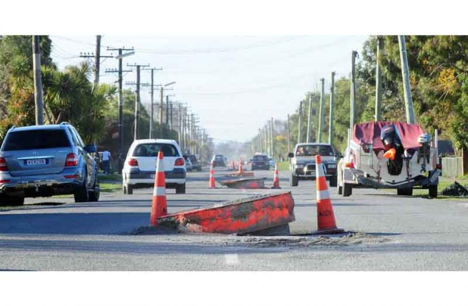 The earthquake poped sewer man holes out of streets all over Brooklands. Photo by Craig Baxter.