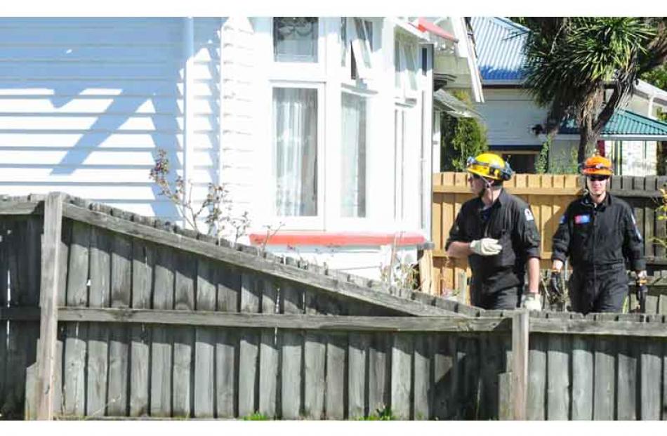 USAR staff check houses on Westminister Street. Photo by Craig Baxter.