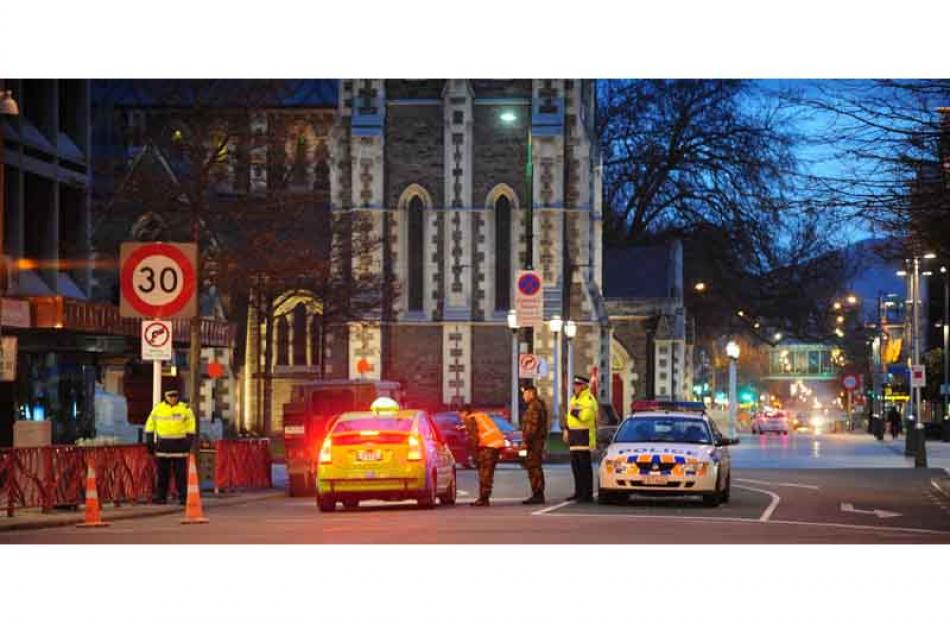 Army and police stopping cars coming in to Cathedral Square last night. Photo by Craig Baxter.