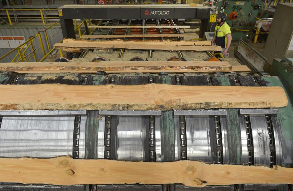 Raw logs are readied for further milling at the Milburn plant.