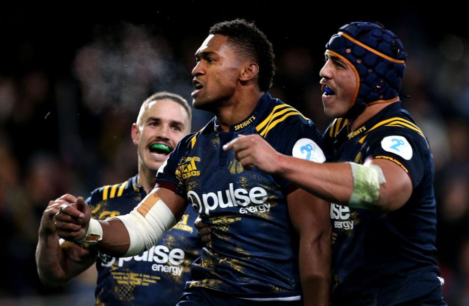 Waisake Naholo celebrates after scoring the Highlanders' first try. Photo Getty