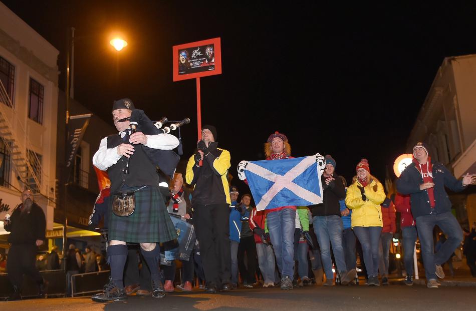 Lions and Highlanders fans leave the Octagon on their way to Forsyth Barr Stadium last night....